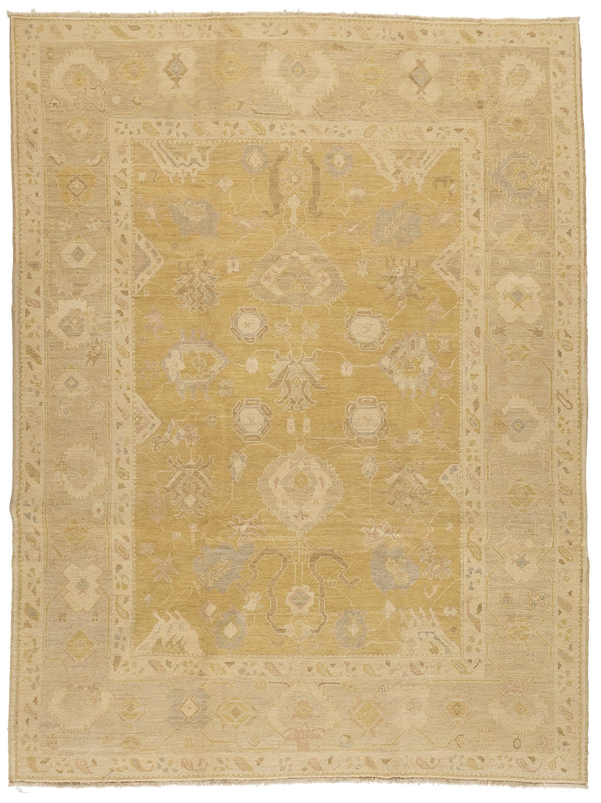 Decorative yellow rug with intricate patterns on a plain background