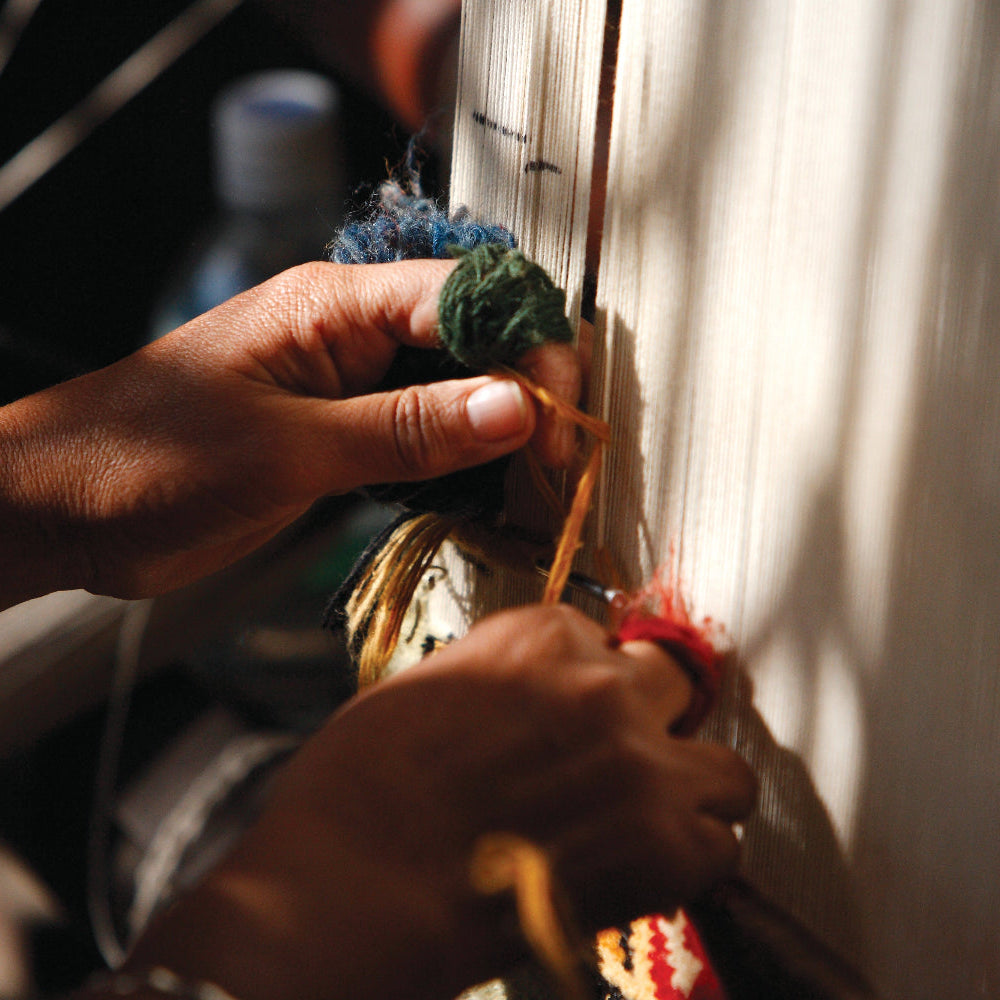 Someone weaving.