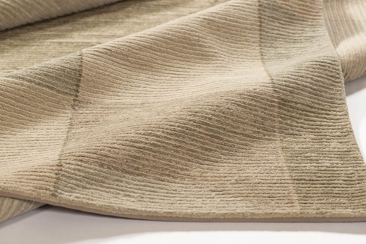 detail image of Cosmos Beige hand knotted area rug design by Tufenkian