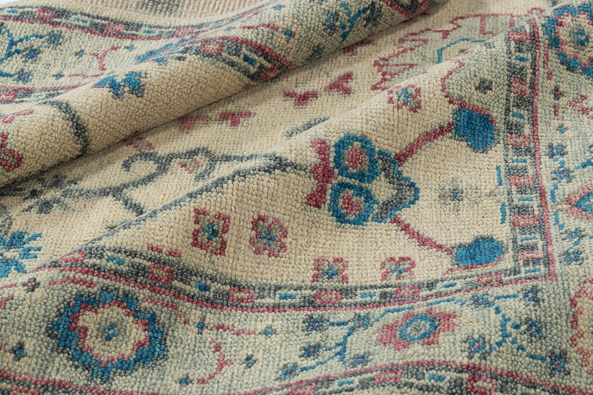 detail image of Donegal III Ivory Rose hand knotted area rug design by Tufenkian